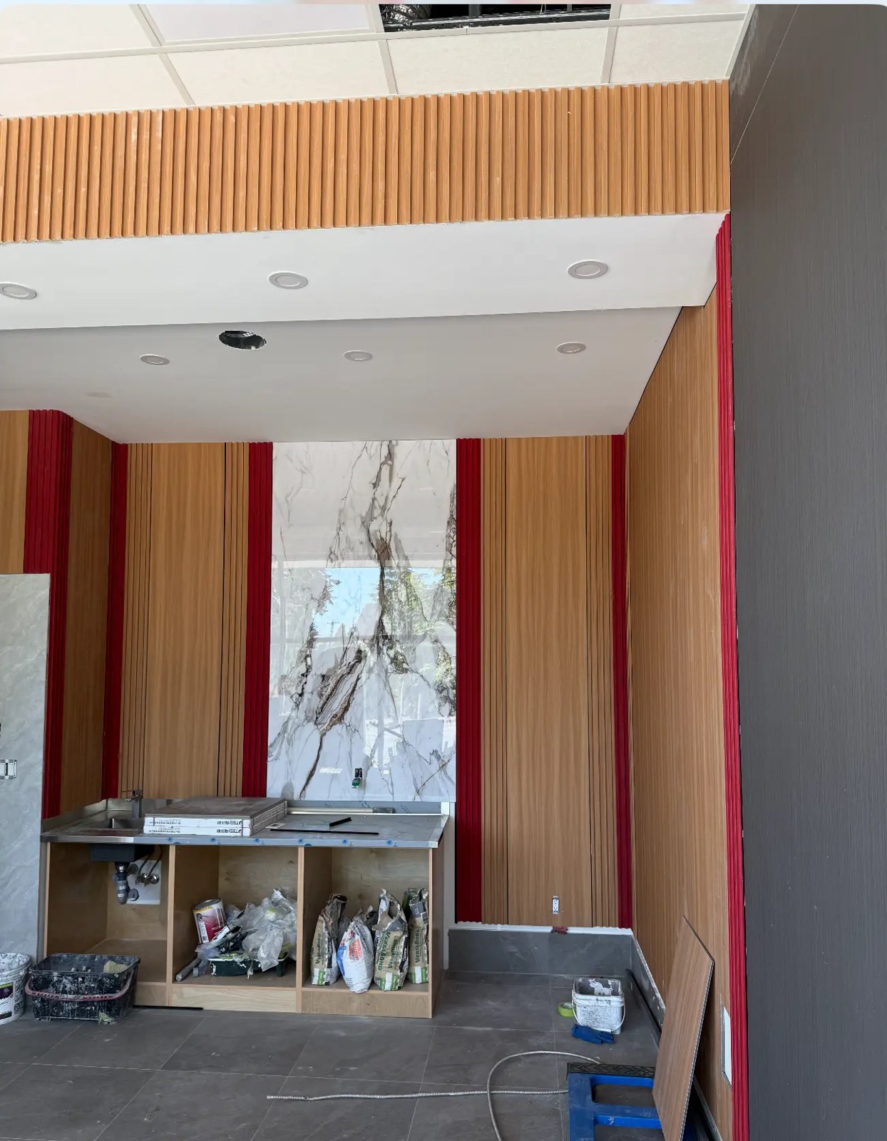 Pizza 64 restaurant interior at 64 Ave and 132 St in Surrey with fluted wood panelling and large-format tile floor
